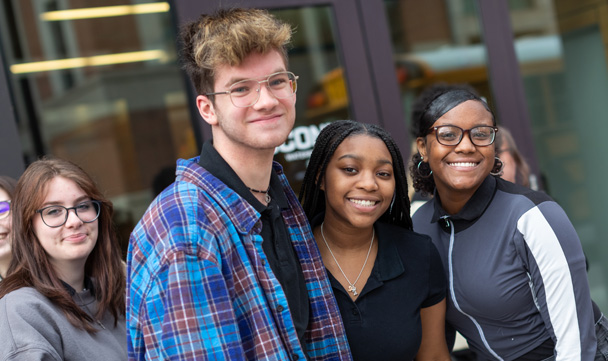 Four WISHfest attendees smile