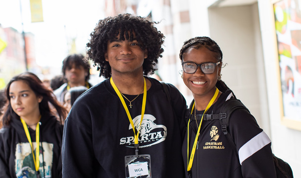 Three WISHfest attendees from a local high school smile for the camera