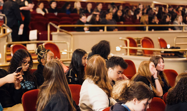 Students site in the audience
