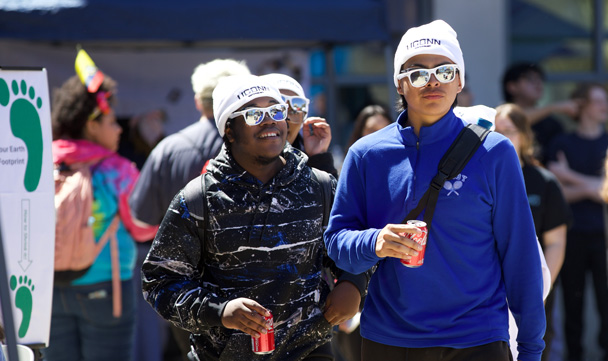 Students walk outside to visit exhibits