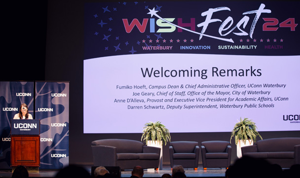 Provost Anne D'Alleva delivers welcoming remarks from the stage