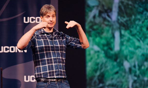 Topher White speaks from the stage